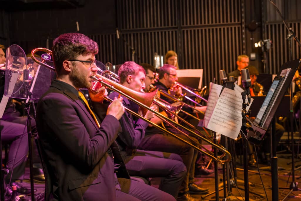 Brass players rehearsing with The People's Big Band