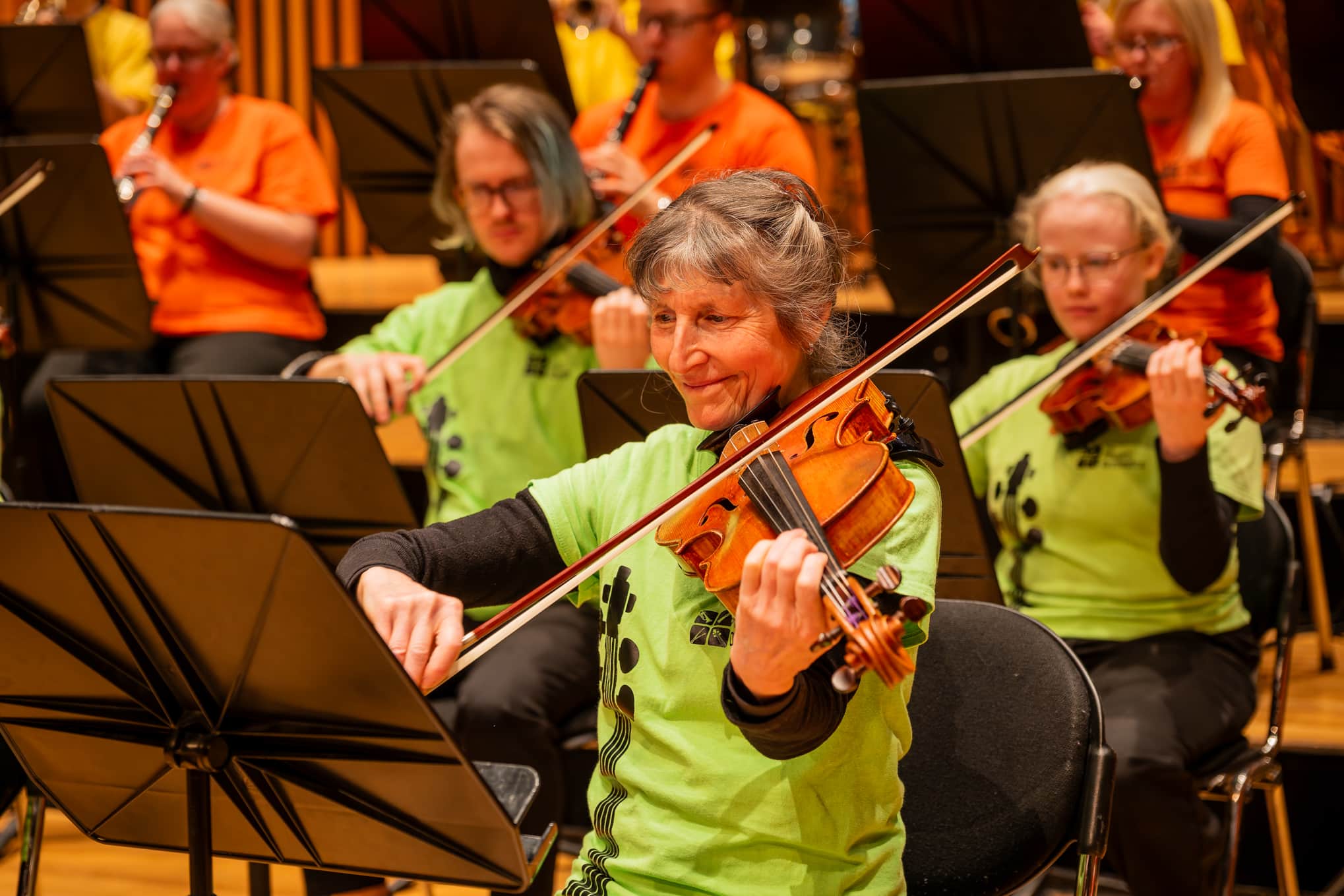 Violaist playinbg her instrument in The People's Orchestra.