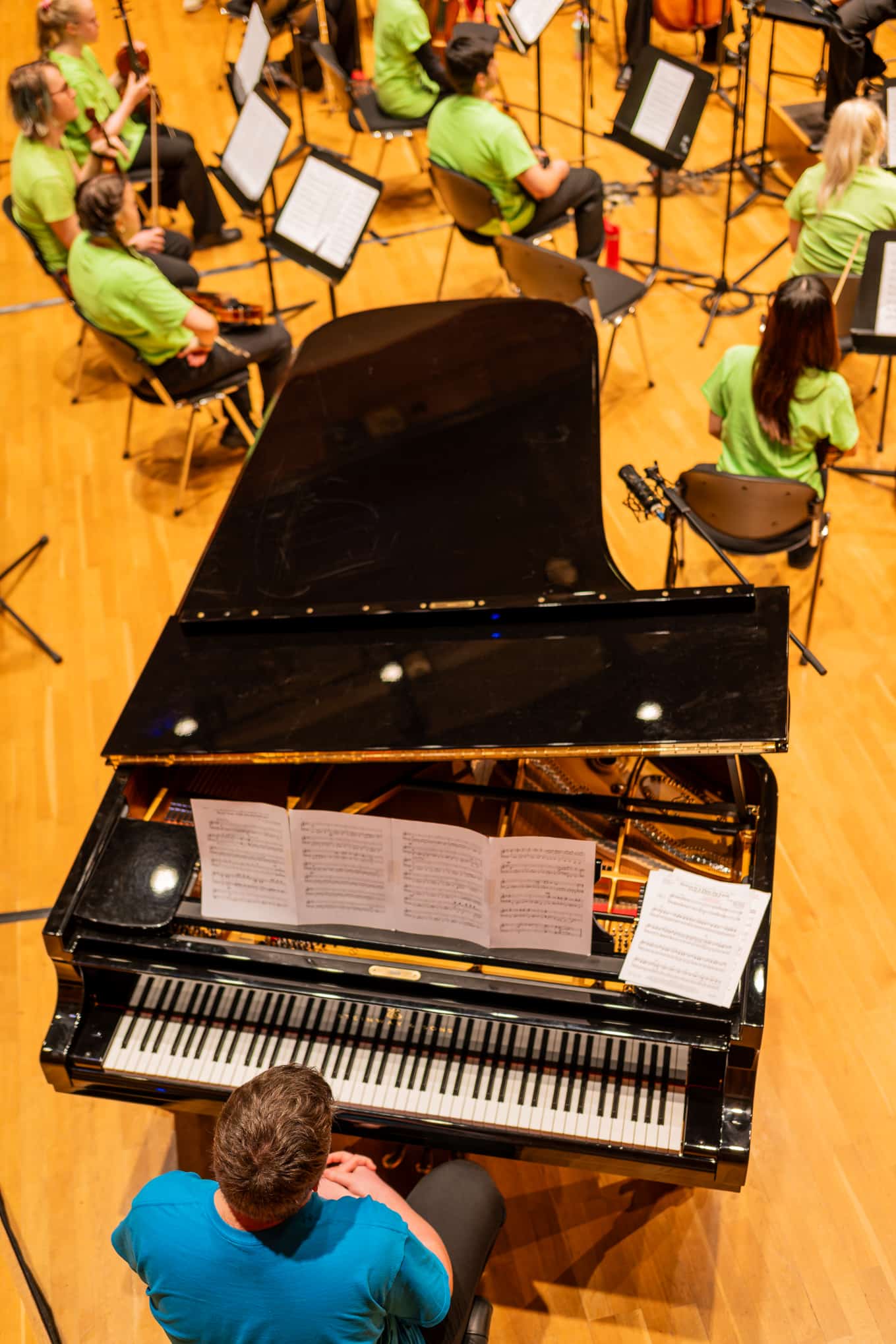 Elliot Atkinson playing the piano at The Ruddock Performing Arts Centre.