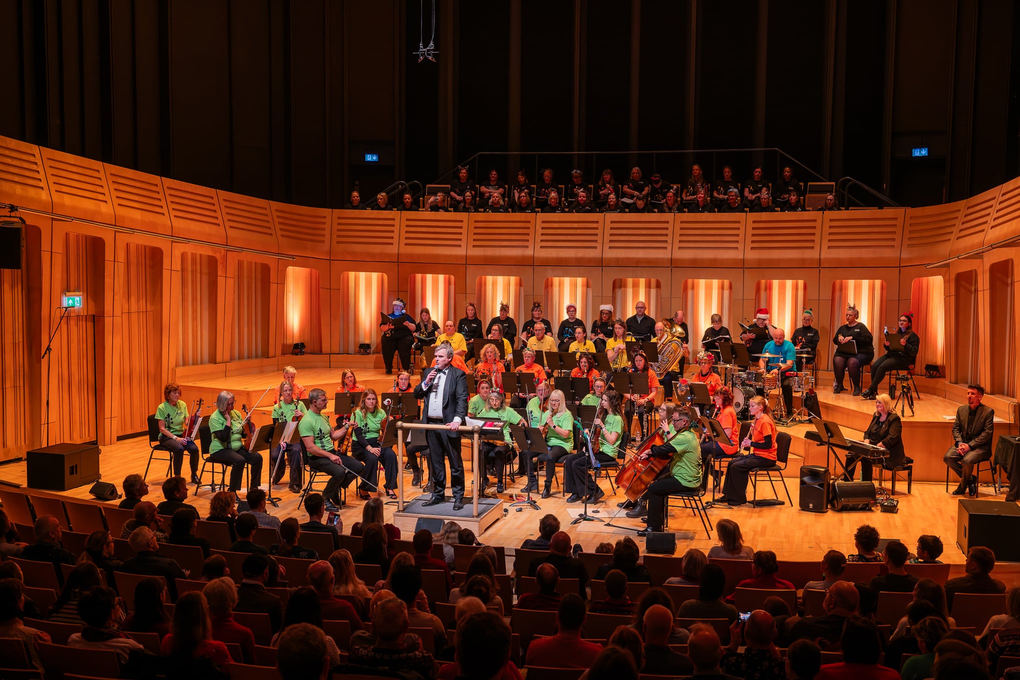 The People's Orchestra, The Rusty Players Orchestra and The People's Show Choir on stage at Dora Stoutsker Hall in Cardiff.