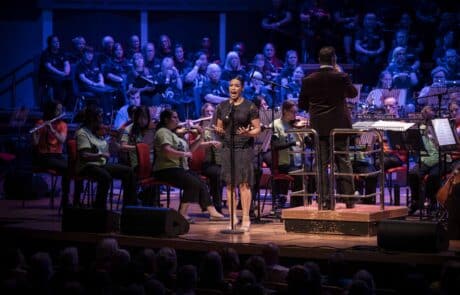 Operatic singer performing on stage.