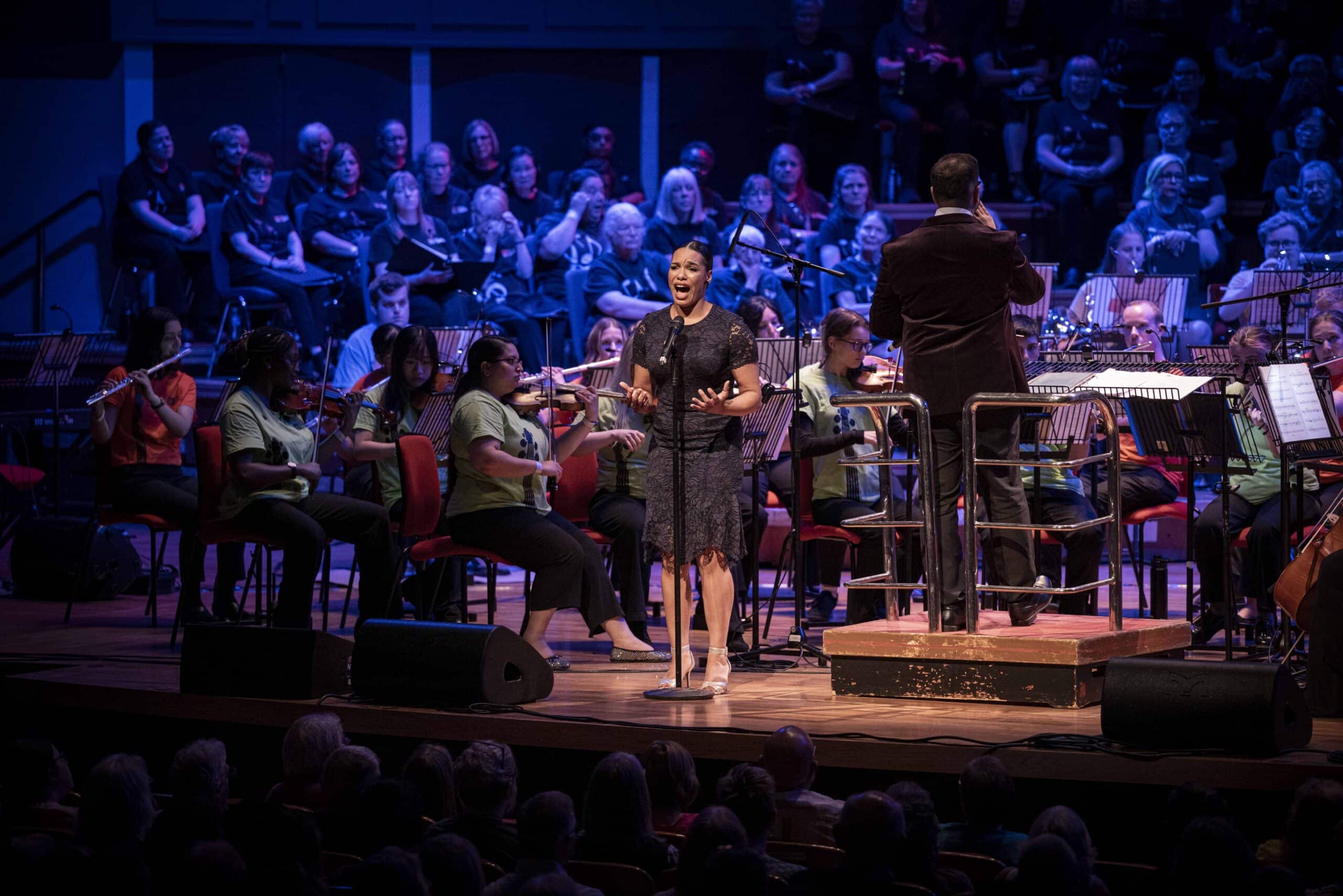 Operatic singer performing on stage. 